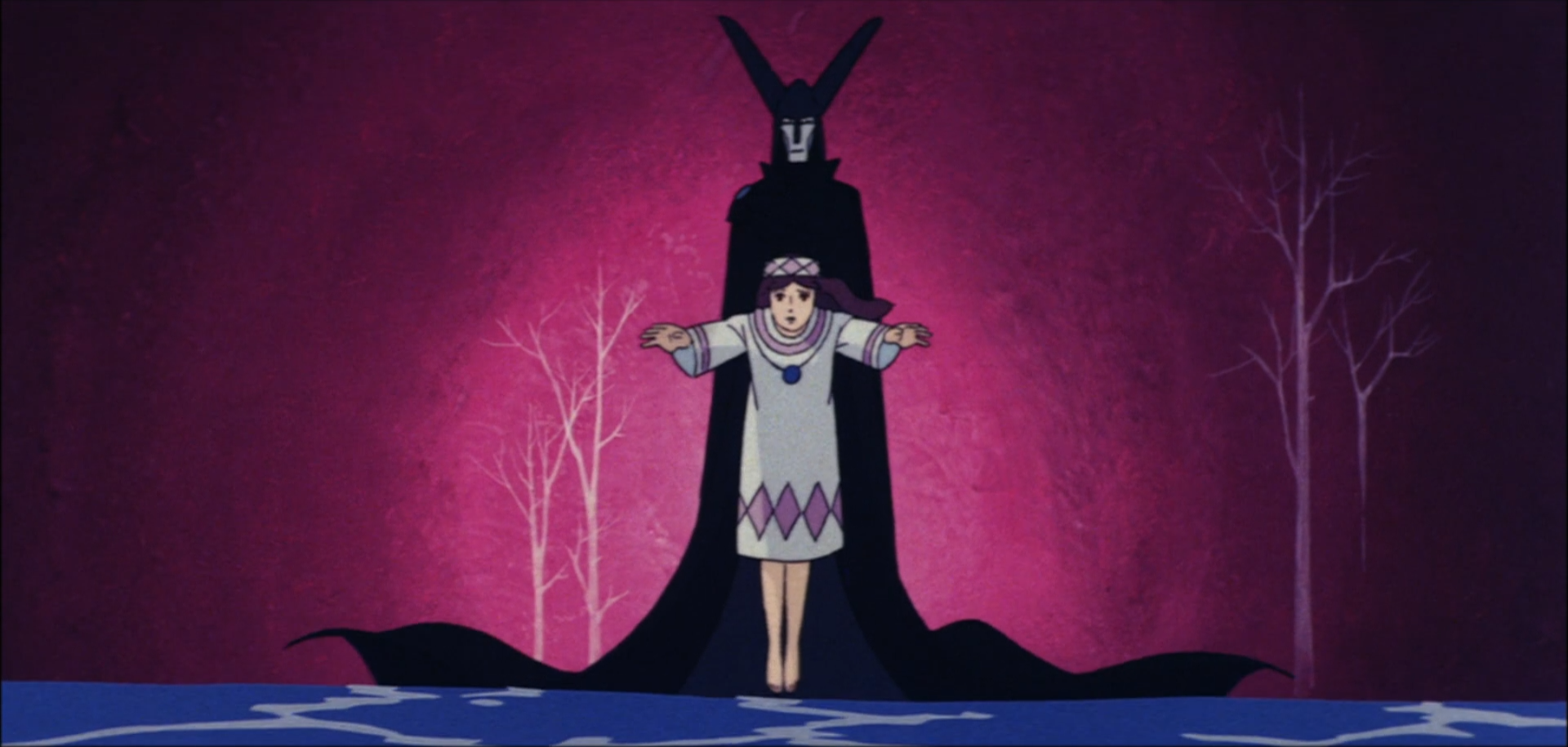 Image: A tall figure cloaked in black, stands behind the young heroine of the film, her arms are extended out towards the camera, her mouth in a silent plea.